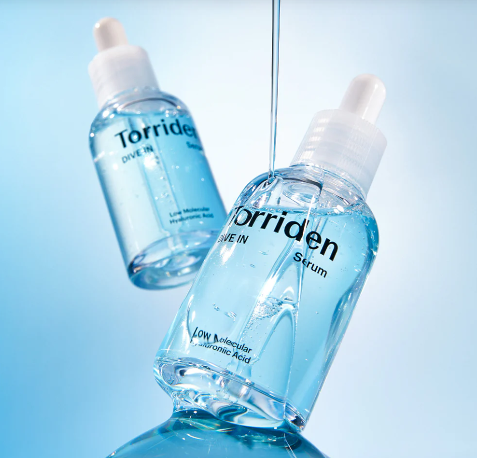 Two bottles of Torriden serum on a light blue background